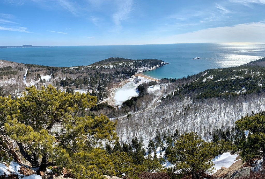 A panoramic winter view from a mountain overlooking Acadia National Park.
